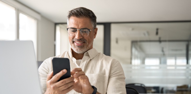  Man with glasses and mobile device