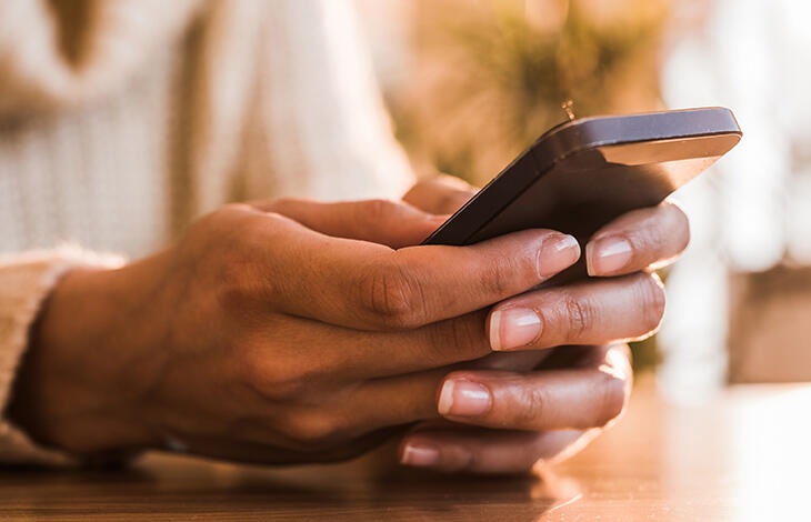 A person looking at their cell phone