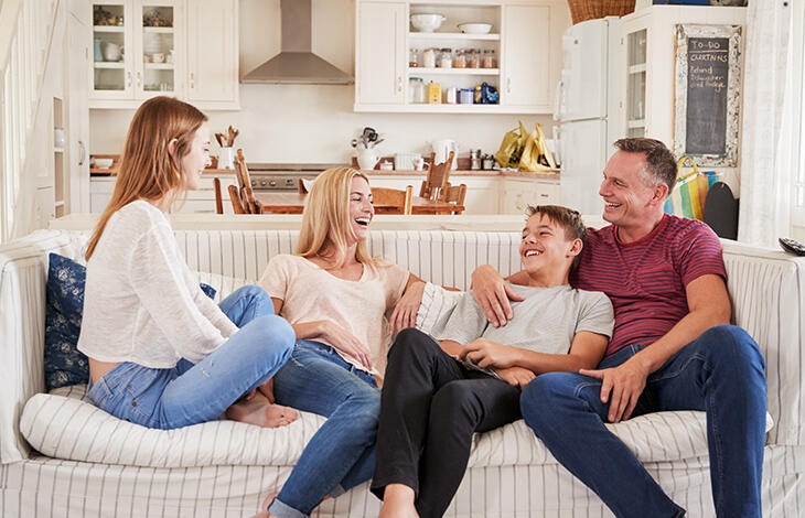 A family chatting in the living room