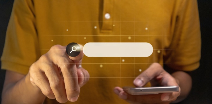 recherche loupe main mobile
