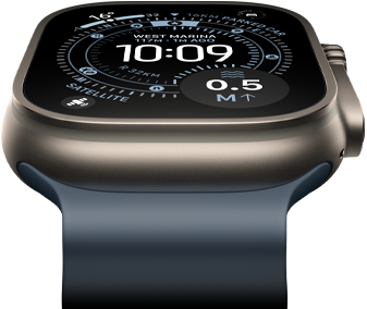Apple Watch Ultra 3 tilted forward, natural titanium case, compass on Orienteering watch face, anchor blue Ocean Band