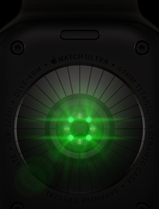 Dos d’une Apple Watch Ultra 4, boîtier en titane, couleur noir, plusieurs capteurs ronds à DEL vertes illuminées