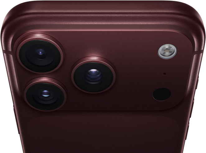 iPhone 18 Pro Max, burgundy colour (dark red), back exterior, Pro Fusion camera system at top, 3 lenses, variable aperture blades partially closed, flash, microphone and LiDAR Scanner, top exterior, cellular antenna, flat sides, rounded edges