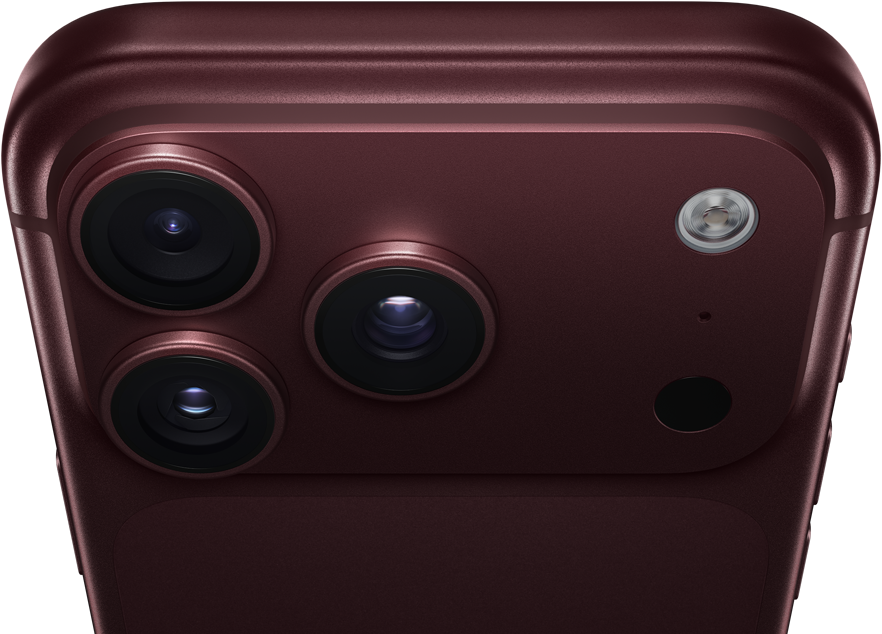 Un iPhone 18 Pro Max, couleur bourgogne (rouge foncé), face arrière, système caméra Pro Fusion dans la partie supérieure, 3 objectifs, lames d’ouverture variable partiellement fermées, flash, microphone et scanneur LiDAR, dessus, antenne cellulaire, côtés plats, bords arrondis