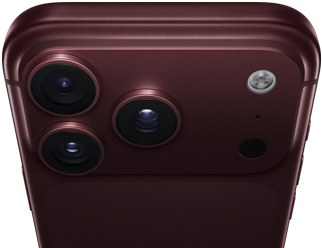 Un iPhone 18 Pro Max, couleur bourgogne (rouge foncé), face arrière, système caméra Pro Fusion dans la partie supérieure, 3 objectifs, lames d’ouverture variable partiellement fermées, flash, microphone et scanneur LiDAR, dessus, antenne cellulaire, côtés plats, bords arrondis