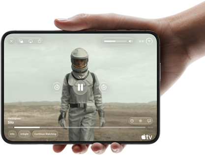 iPhone Duo, held with one hand, opened in horizontal orientation, fully unfolded, interior screen displays Apple TV show "Silo"