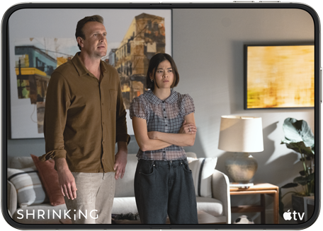 iPhone Duo, opened in horizontal position, Apple TV show "Shrinking" plays on screen
