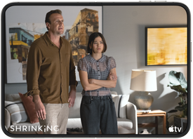 iPhone Duo, opened in horizontal position, Apple TV show "Shrinking" plays on screen