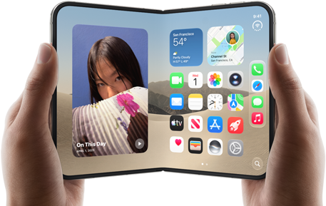 iPhone Duo, Star White colour, held by two hands in landscape orientation, unfolded, interior screen displays photos on the left, apps on the right
